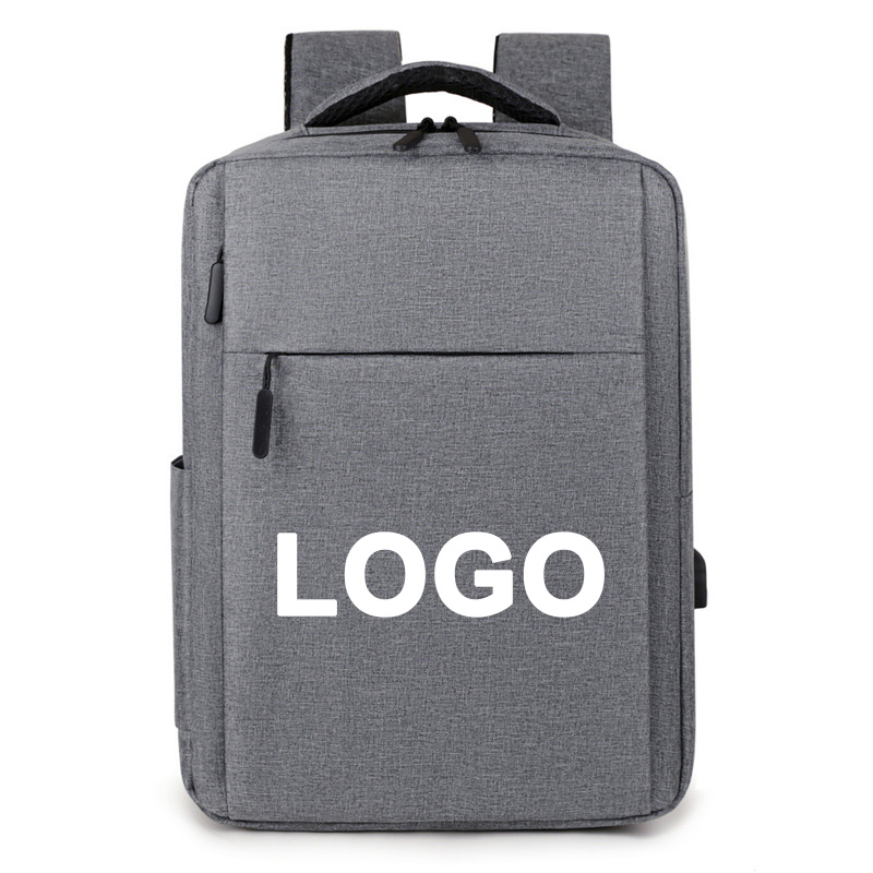 Heather-grey structured backpack front-on against a pale background, white placeholder word printed across the lower front panel, black top grab handle, twin zipper pulls under the handle, side slip pocket at the left edge