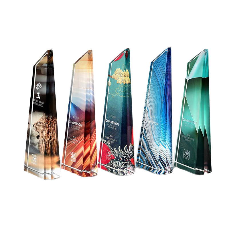 five tall wedge acrylic trophy boards with printed colour themes lined up against a white background